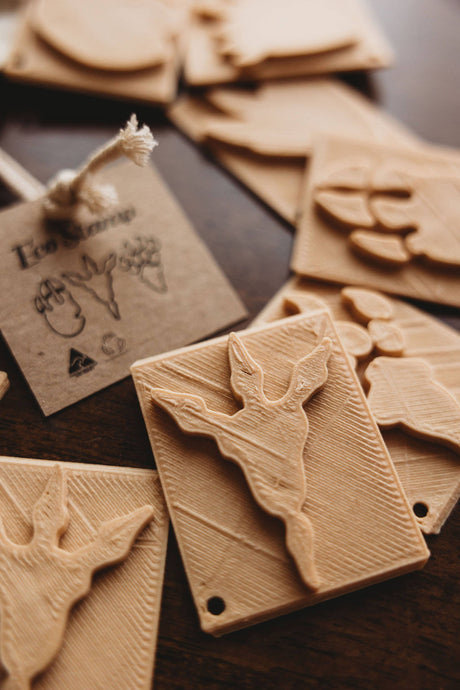 Eco playdough dino stamps on a wooden surface