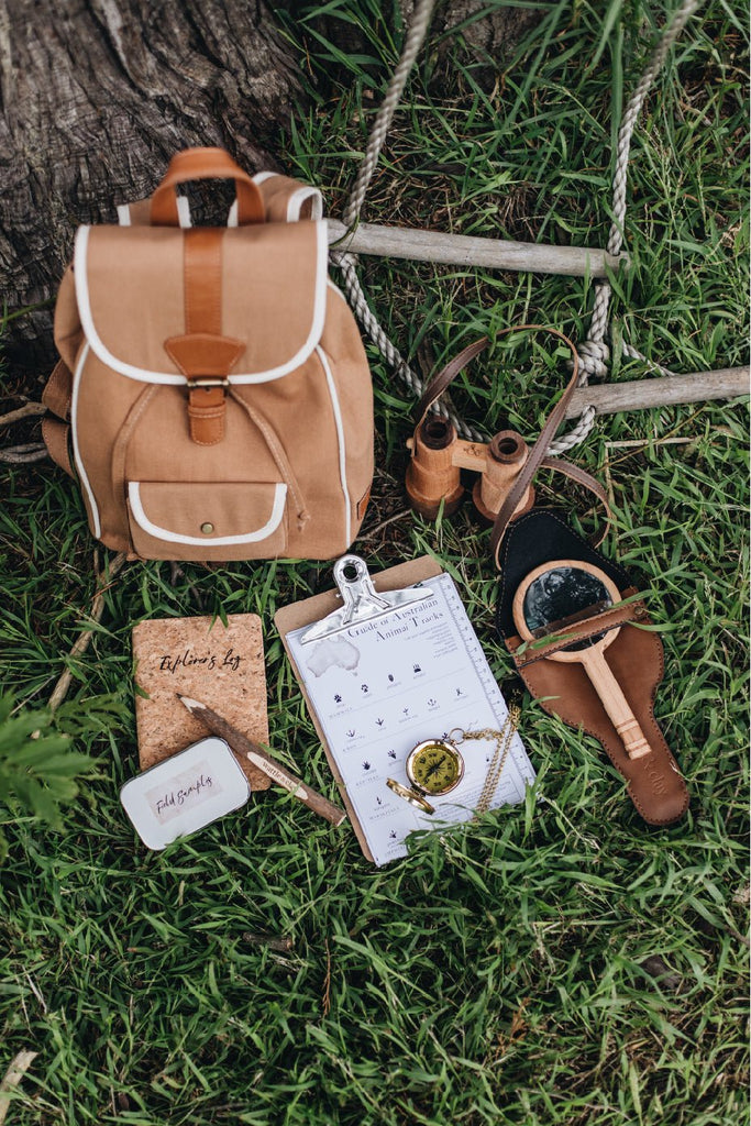 Explorer's Kit - Canvas backpack filled with adventurers' gadgets and tools