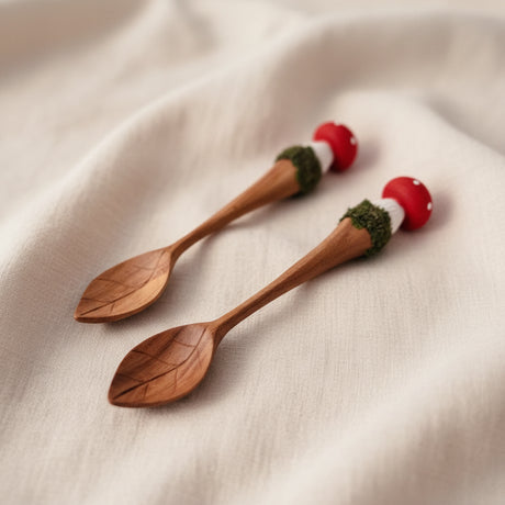 Three wooden spoons with mushroom-shaped handles 