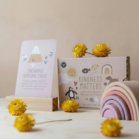Educational cards and wooden toys on a light surface with a neutral background