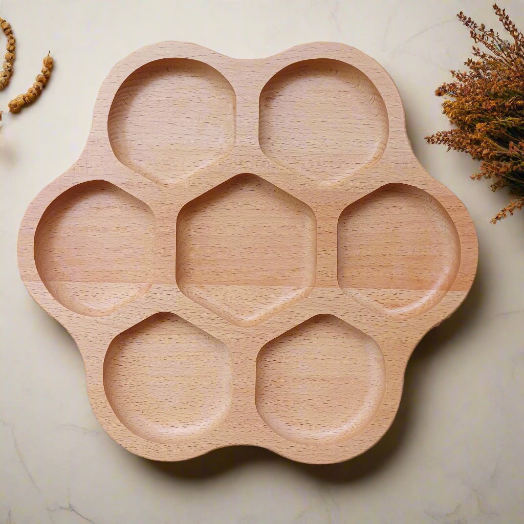 Wooden flower tray with geometric shapes on a woven mat background