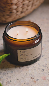 double wick candle on concrete surface burning 