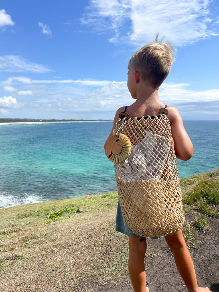 Beach Brush Sand Remover on back pack
