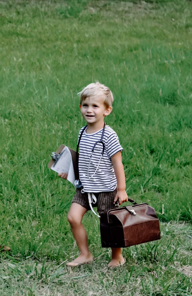 Child  playing with medical bag